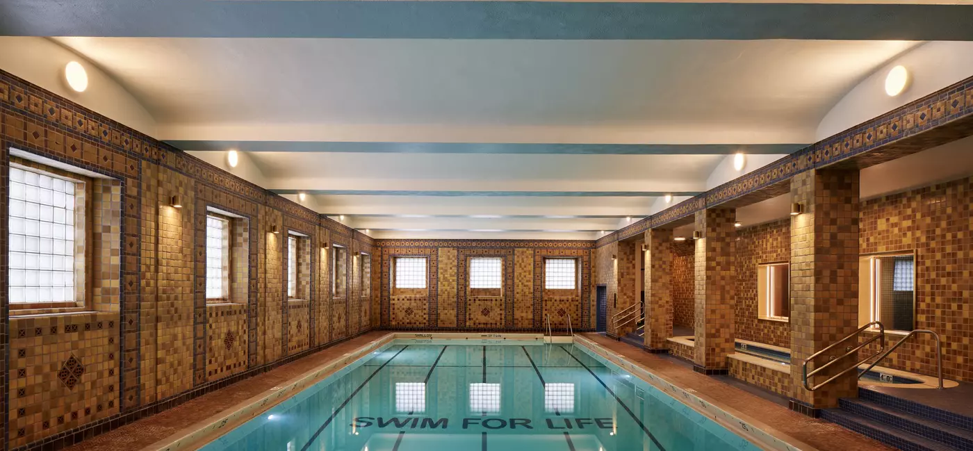 The indoor swimming pool at 21c Museum Hotel in St Louis, with mosaic-tile walls in autumn tones