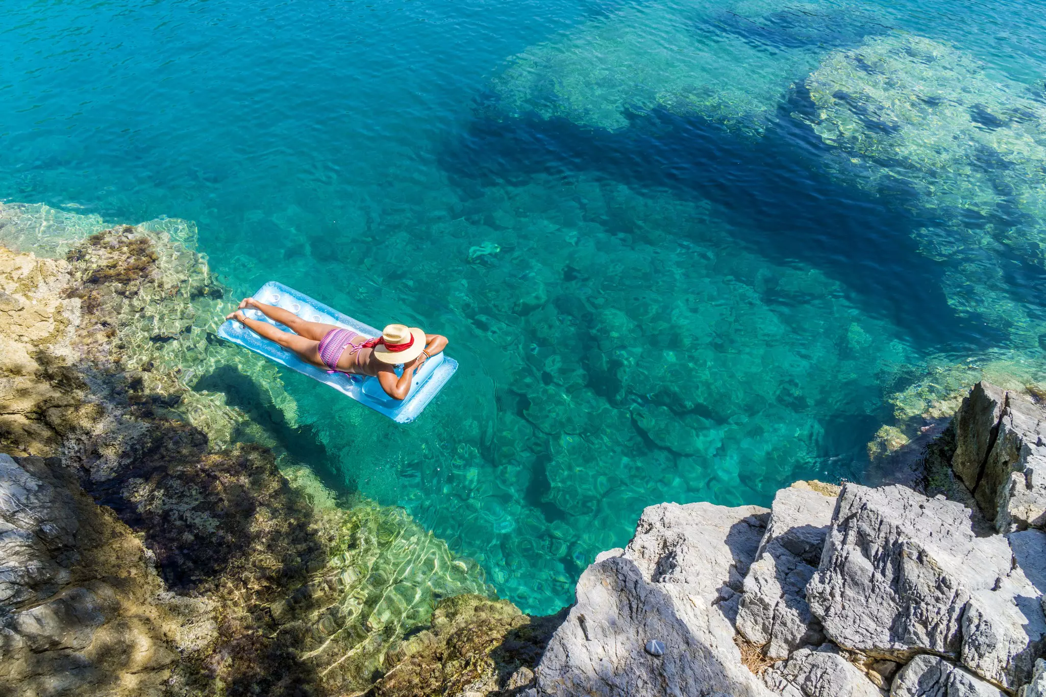 Women sunbathing on a seabed on the Turkish coast