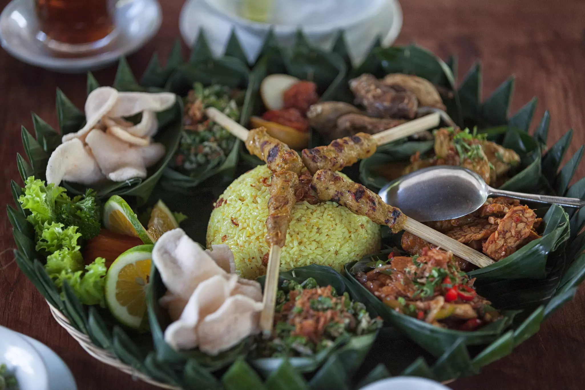 Order a rijstaffel for a broad selection of Indonesian dishes © Ida Bagus Dharmayana / Getty Images