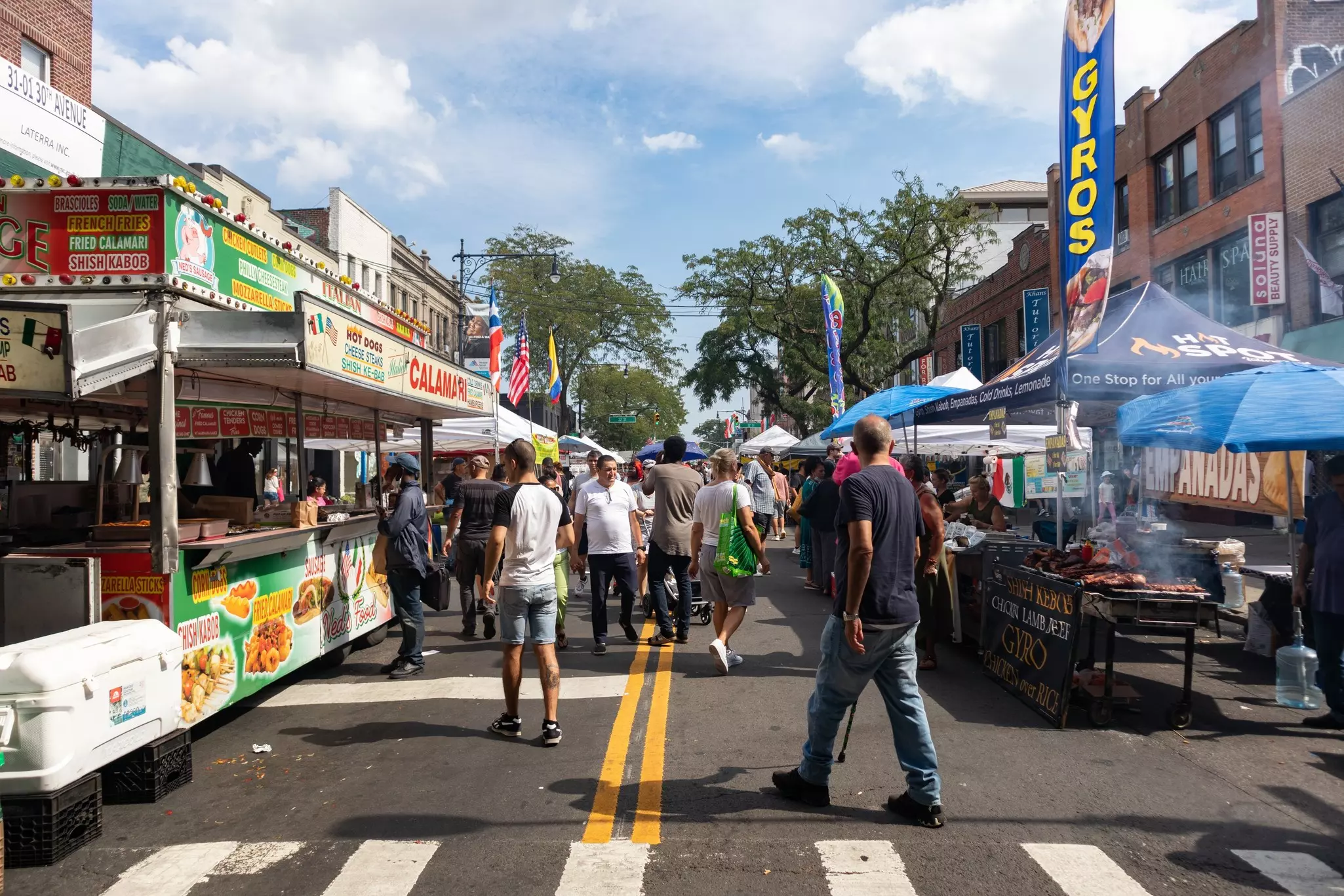 Food vendors and stalls at a street market in Astoria, Queens. 
