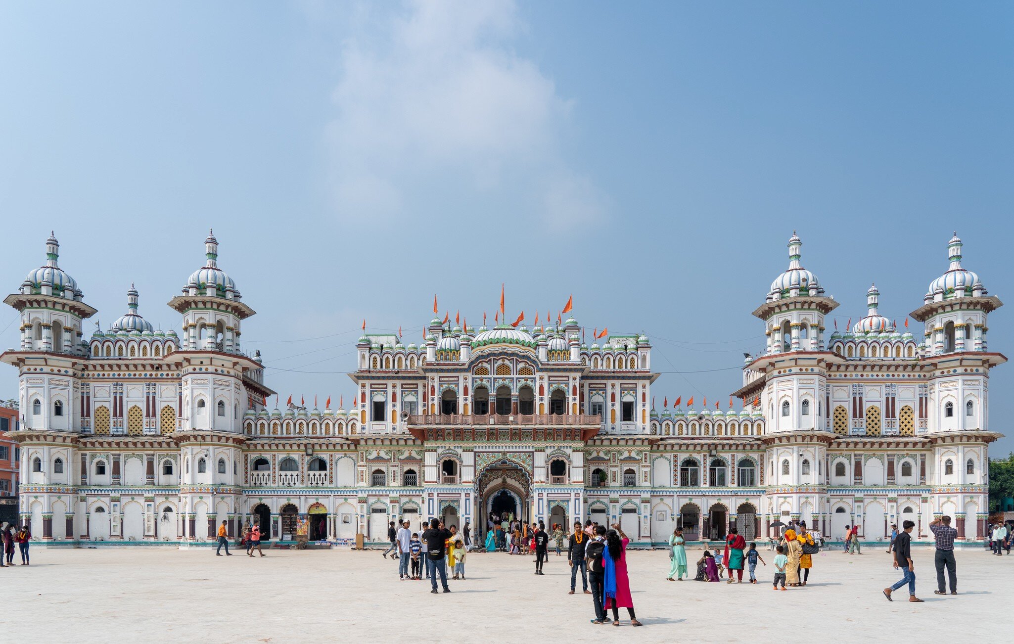 Pilgrims walking on the plaza of the Janaki Mandir in Janakpur, Nepal.