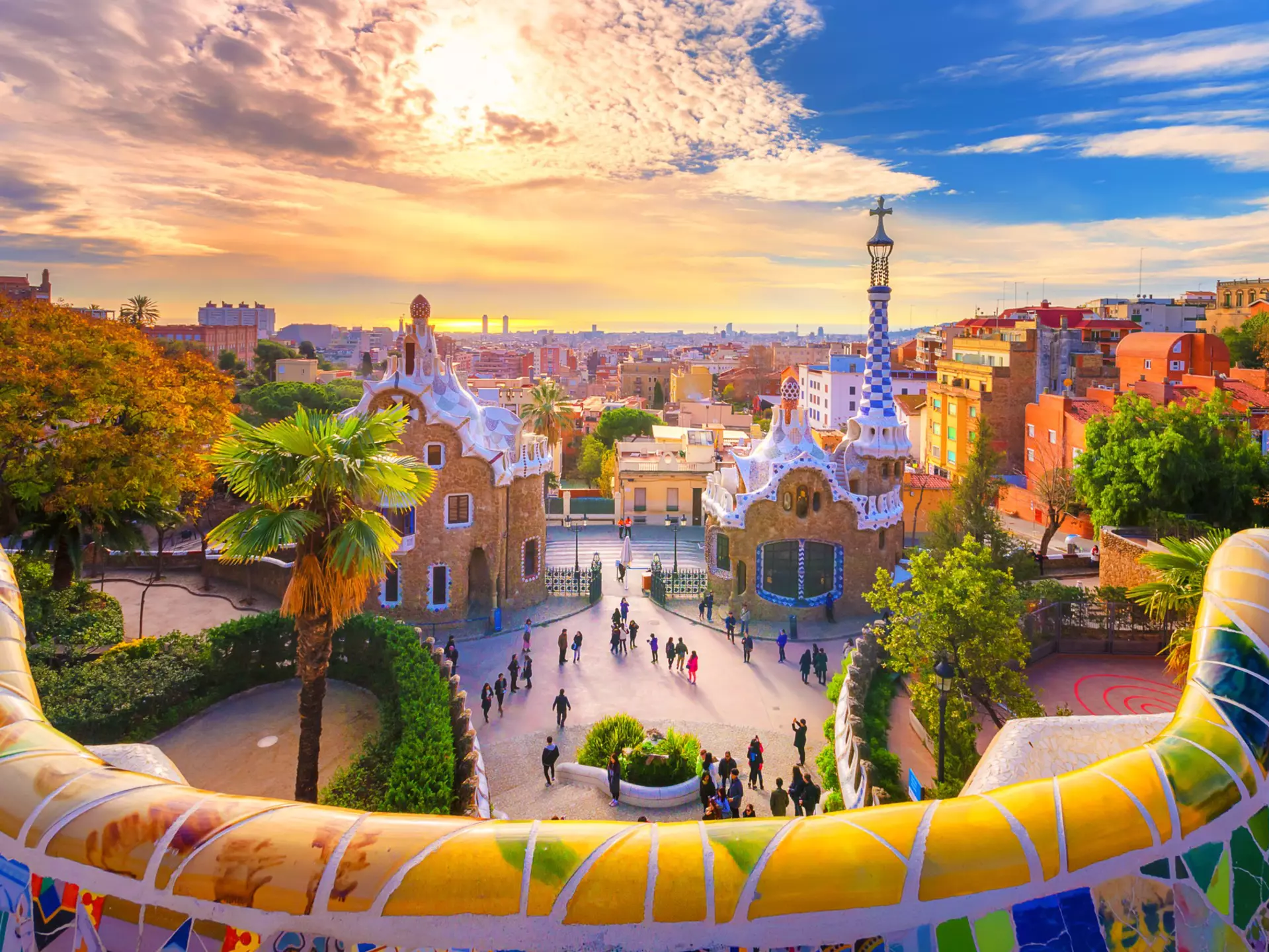 View of the city from Park Guell in Barcelona, Spain
1137803766
guell, park, barcelona, gaudi, catalan, outdoor, view, seats, landmark, touristic, building, modernism, ceramic, famous, colorful, artistic, structure, golden colors, colorful sky, clouds, sunrise, Modern, Catalonia, Museum, Barcelona - Spain, People, Sunset, Photography, Barcelona, City, Travel, Spain, Outdoors, Park Bench, Sunrise, Cityscape, Architecture, Summer, Seat, Colorful Sky, Bench, Antoni Gaudí, Multi Colored, Cloud - Sky, Travel Destinations, Horizontal, Fantasy, Built Structure, Blue, Building, Monument, Nature, Europe, Day, Tree, Sky, View, Design, UNESCO World Heritage Site, UNESCO, Mosaic, Famous Place, Tourist, Guell, Tourism, Architect, Park, Public Park, Art, Famous, Town, Ceramics, Creativity, Golden Colors