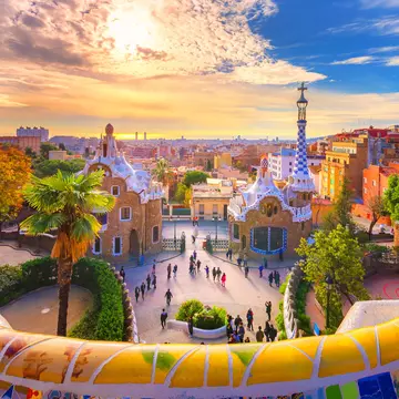 View of the city from Park Guell in Barcelona, Spain
1137803766
guell, park, barcelona, gaudi, catalan, outdoor, view, seats, landmark, touristic, building, modernism, ceramic, famous, colorful, artistic, structure, golden colors, colorful sky, clouds, sunrise, Modern, Catalonia, Museum, Barcelona - Spain, People, Sunset, Photography, Barcelona, City, Travel, Spain, Outdoors, Park Bench, Sunrise, Cityscape, Architecture, Summer, Seat, Colorful Sky, Bench, Antoni Gaudí, Multi Colored, Cloud - Sky, Travel Destinations, Horizontal, Fantasy, Built Structure, Blue, Building, Monument, Nature, Europe, Day, Tree, Sky, View, Design, UNESCO World Heritage Site, UNESCO, Mosaic, Famous Place, Tourist, Guell, Tourism, Architect, Park, Public Park, Art, Famous, Town, Ceramics, Creativity, Golden Colors