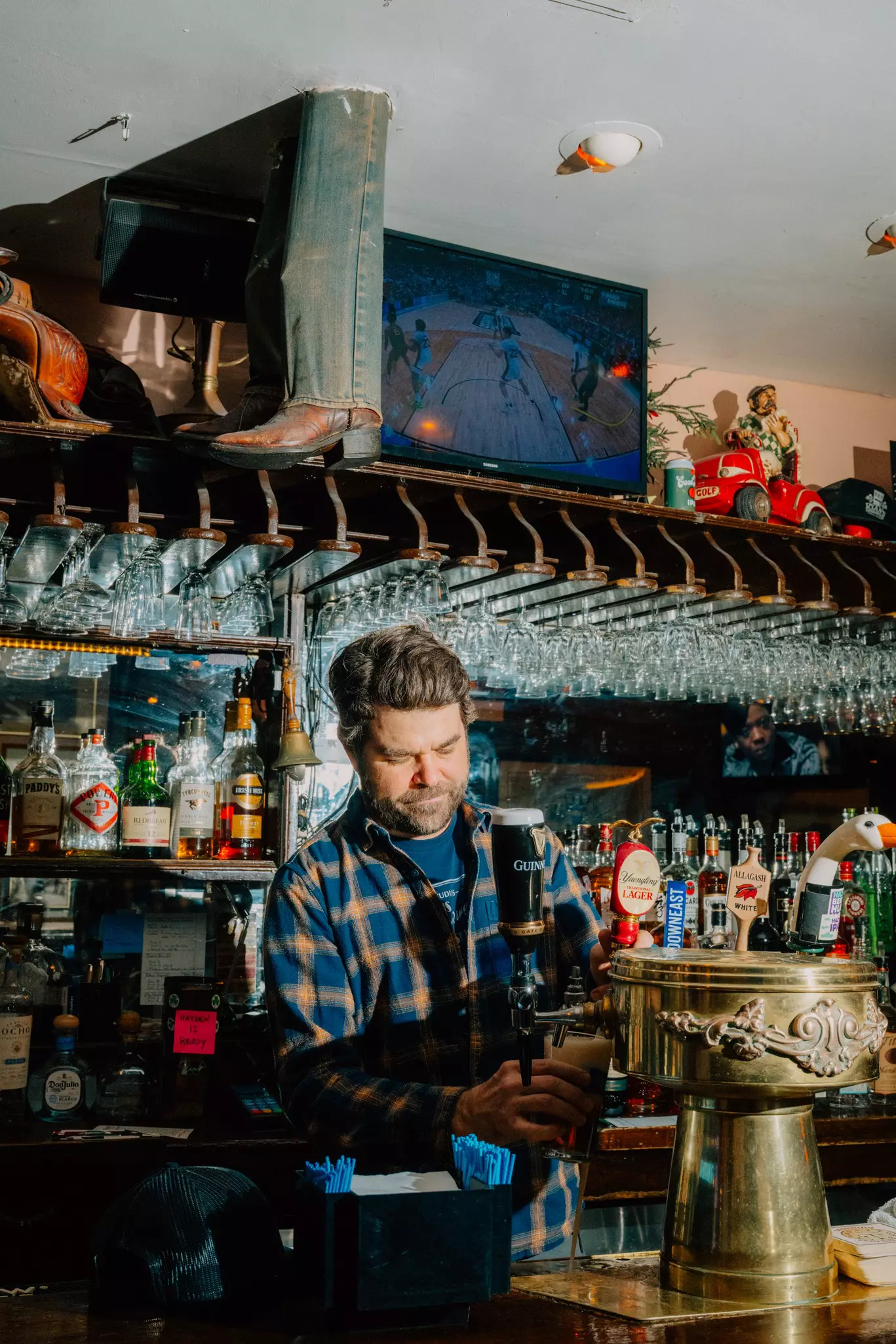 A bartender pours a beer at Ryan's Daughter in Upper East Side, Manhattan, New York