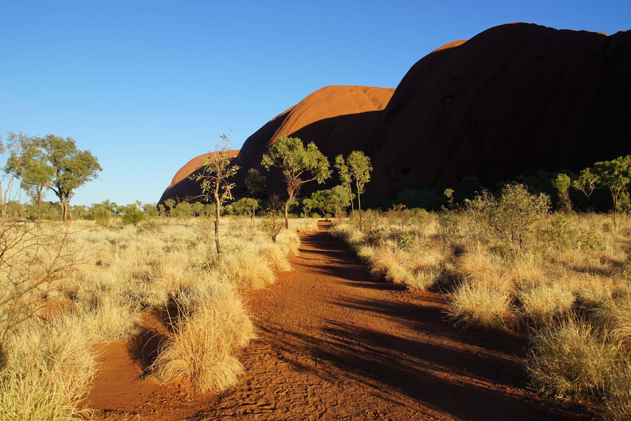 Brilliant Sunlight and Dark Shade on the Kuniya Walk at Uluru, Yulara, Northern Territory, Australia.