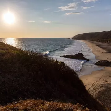 Amazing sunset over the pacific ocean from a hill in Punta Cometa, Mazunte, Mexico