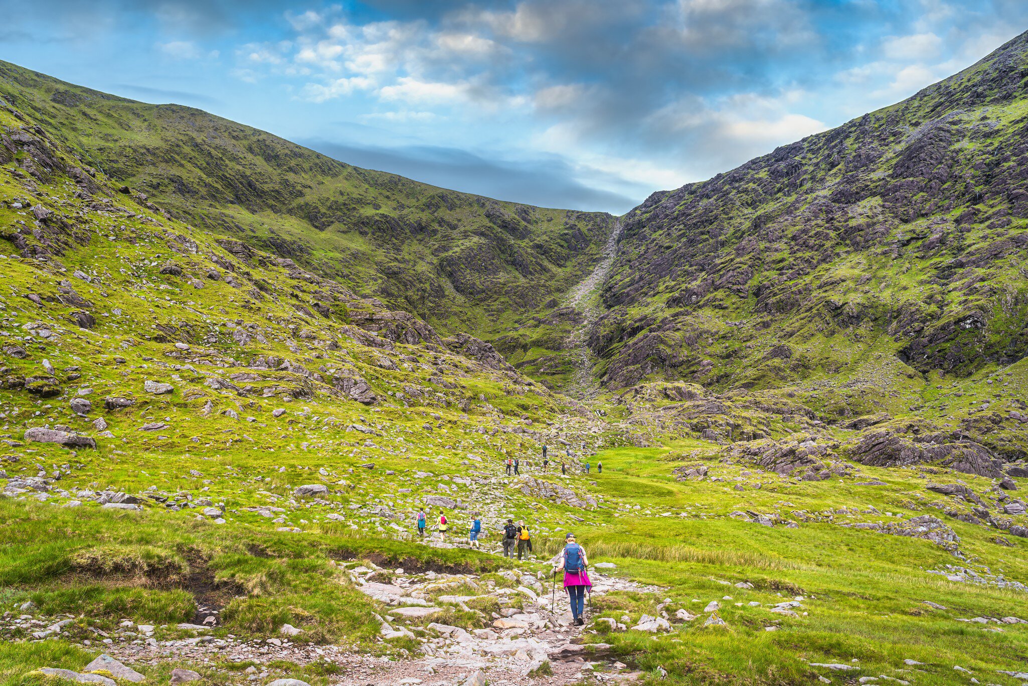 Group of hikers in Cronins Yard starting to climb Devils Ladder to reach the highest mountain in Ireland Carrauntoohil, Ring of Kerry, Ireland  License Type: media  Download Time: 2021-08-06T00:02:52.000Z  User: mvm_lonelyplanet  Is Editorial: No  purchase_order:   