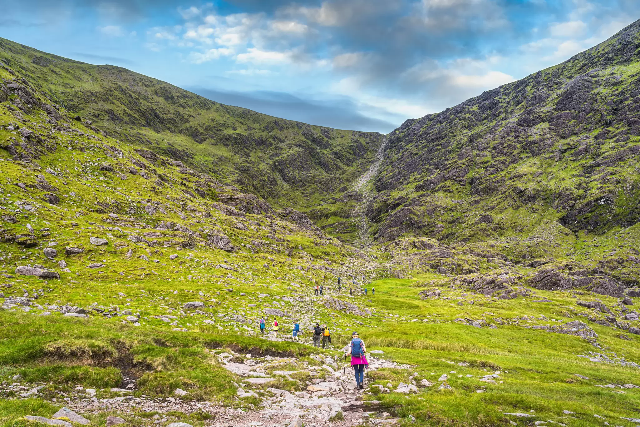 Group of hikers in Cronins Yard starting to climb Devils Ladder to reach the highest mountain in Ireland, Carrauntoohill.