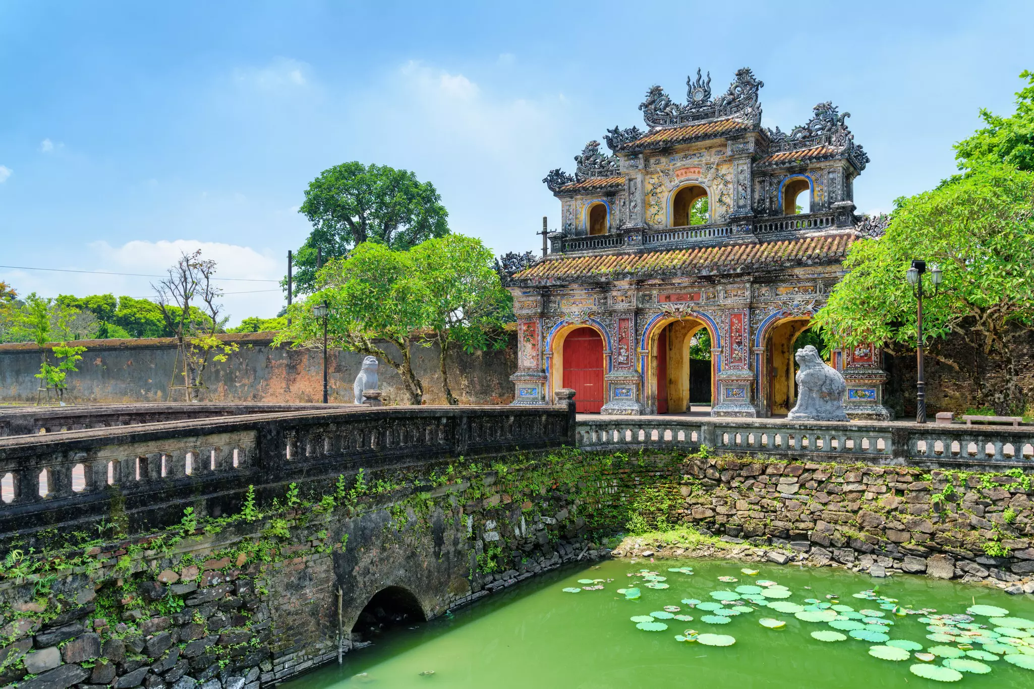 Wonderful view of the East Gate (Hien Nhon Gate) to the Citadel and a moat surrounding the Imperial City with the Purple Forbidden City in Hue, Vietnam. Hue is a popular tourist destination of Asia., License Type: media, Download Time: 2025-05-29T18:48:35.000Z, User: lonelyplanetmedia, Editorial: false, purchase_order: 65050 - Digital Destinations and Articles, job: Global Publishing WIP, client: Global Publishing WIP, other: Peterson Haggarty // SS Comp Ingestion