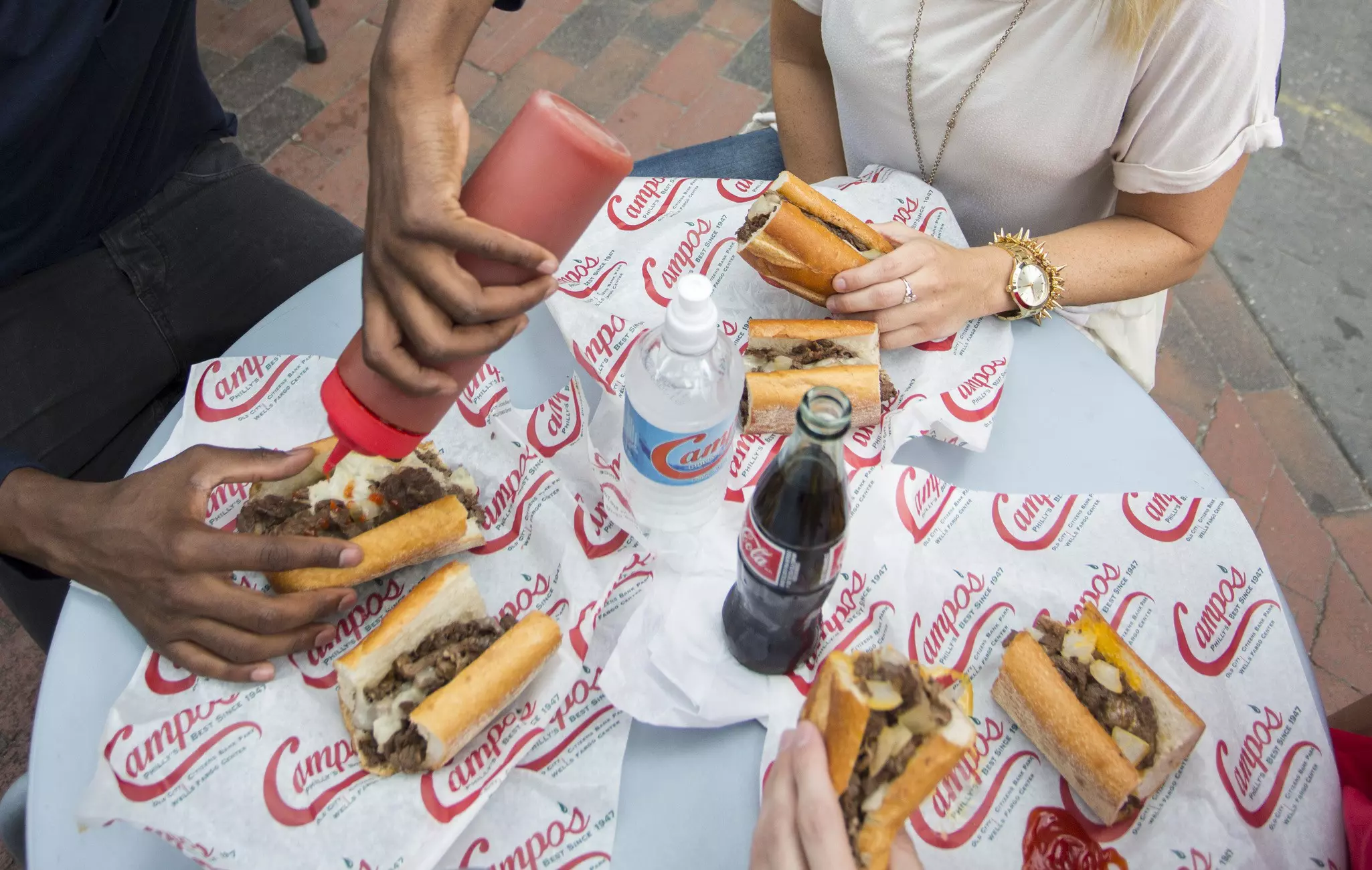 A spread of Philly Cheesesteak sandwiches at Campo's