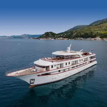 Aerial shot of a large white cruise ship in the Adriatic Sea