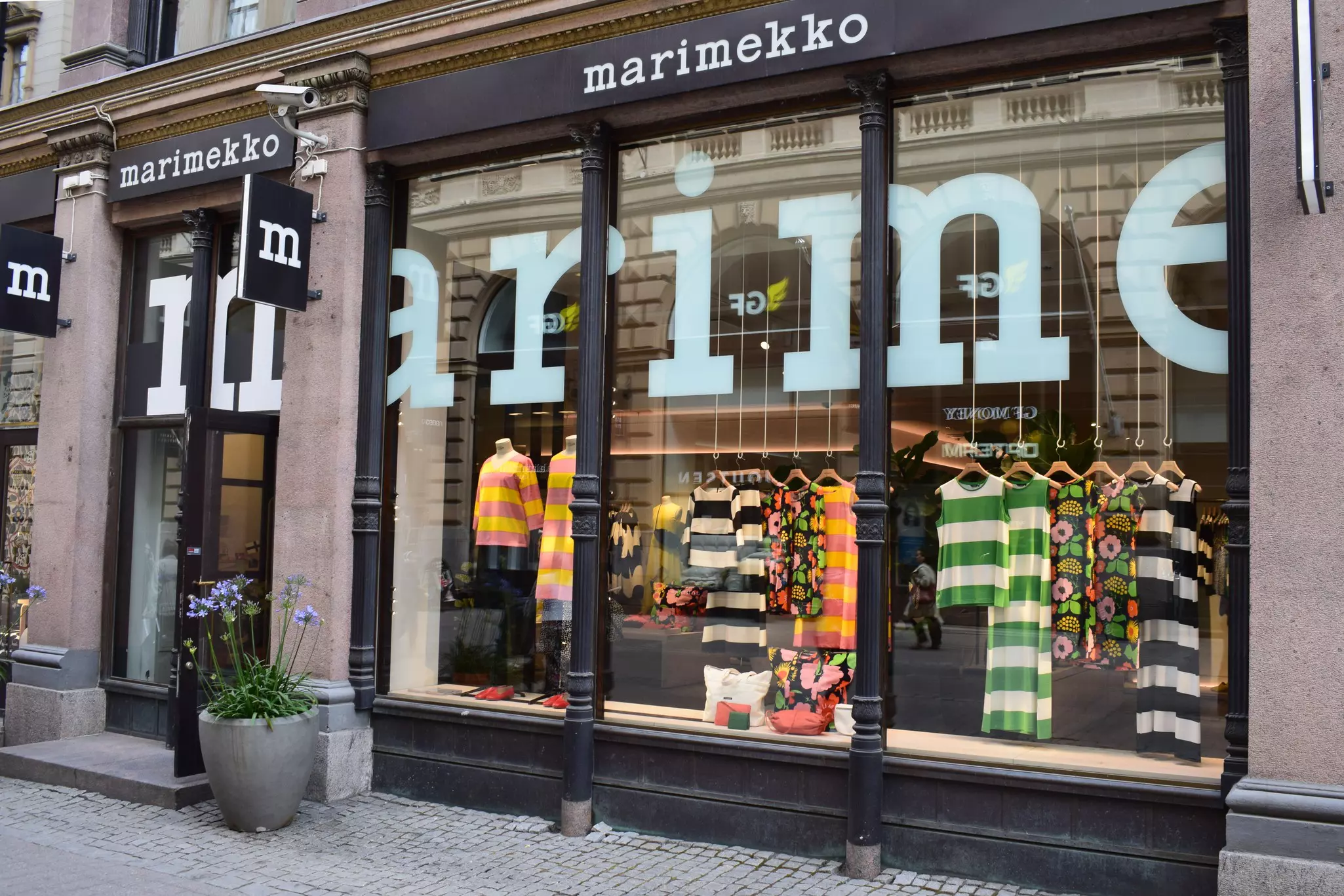 A Marimekko shop in Helsinki, Finland, with brightly patterned clothing displayed in the window.