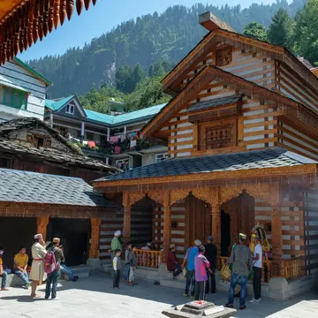 Men making an offering at the Vashishtha temple in Vashisht, Himachal Pradesh, India.
