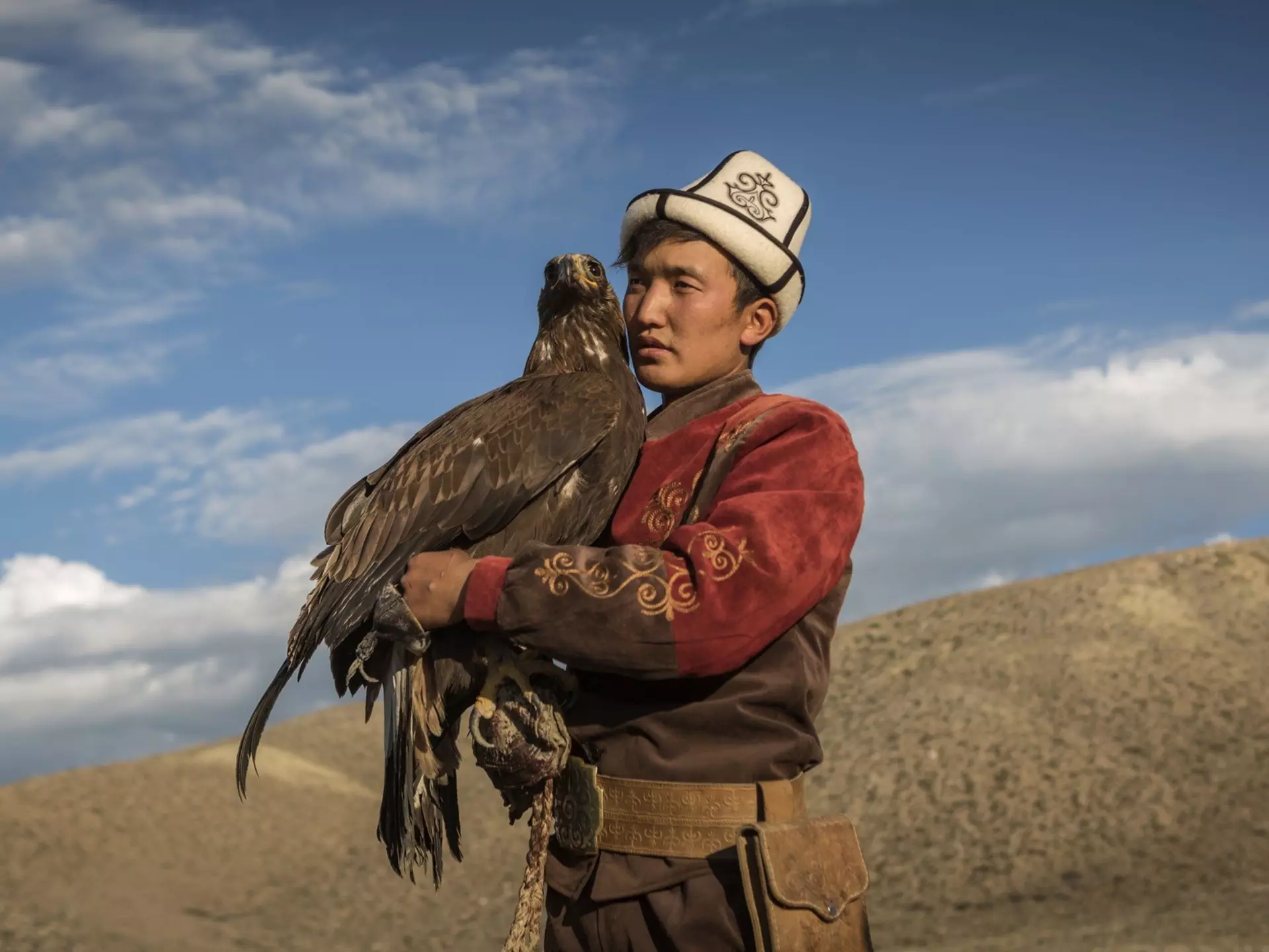 A traditional hunter with his eagle, Kyrgyzstan. Sahan Nuhoglu/Shutterstock