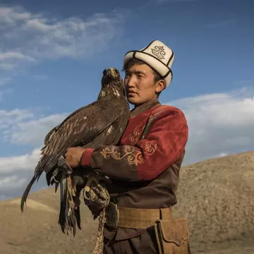 A traditional hunter with his eagle, Kyrgyzstan. Sahan Nuhoglu/Shutterstock