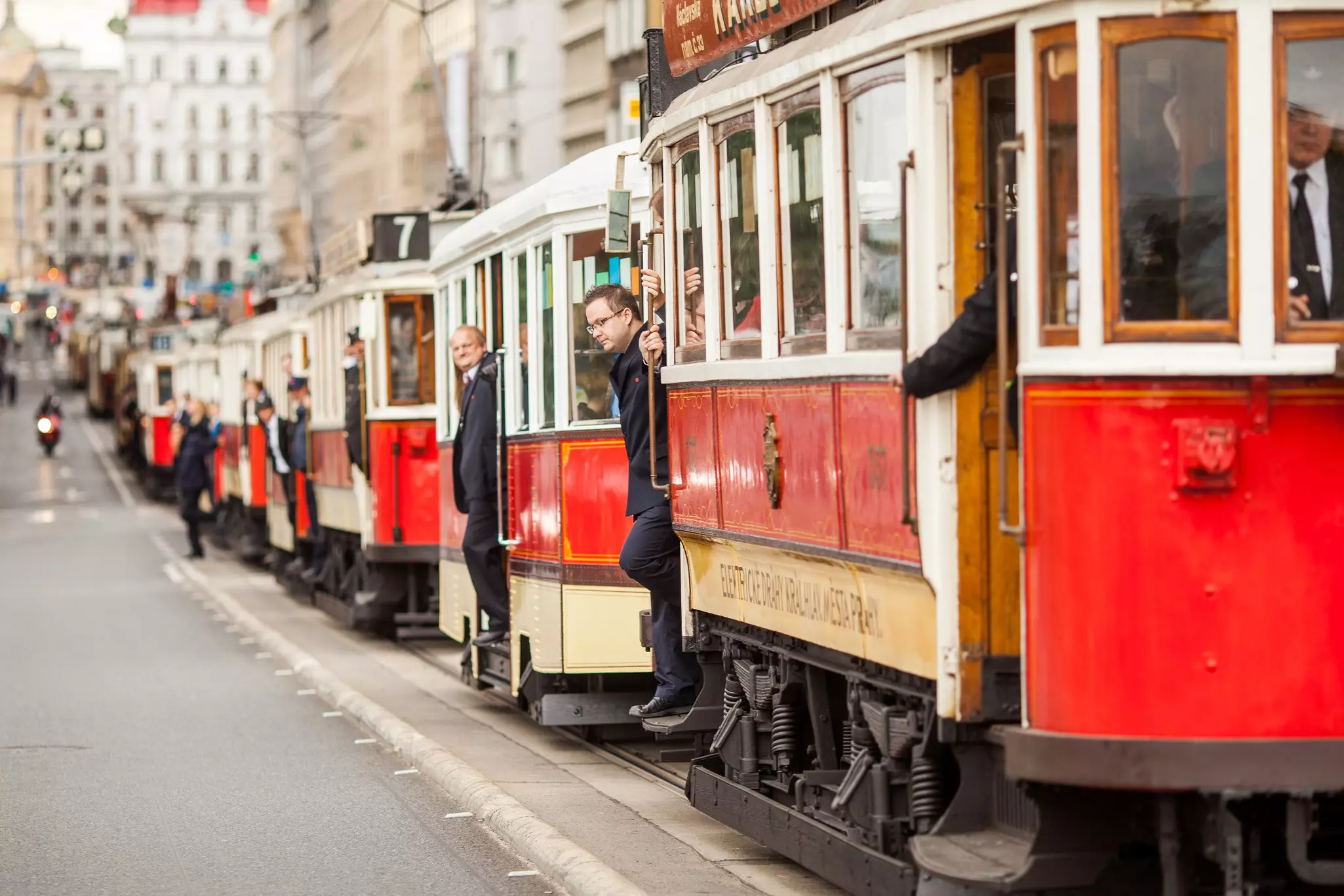 The vintage excursion tram parade goes on the central city street in Prague