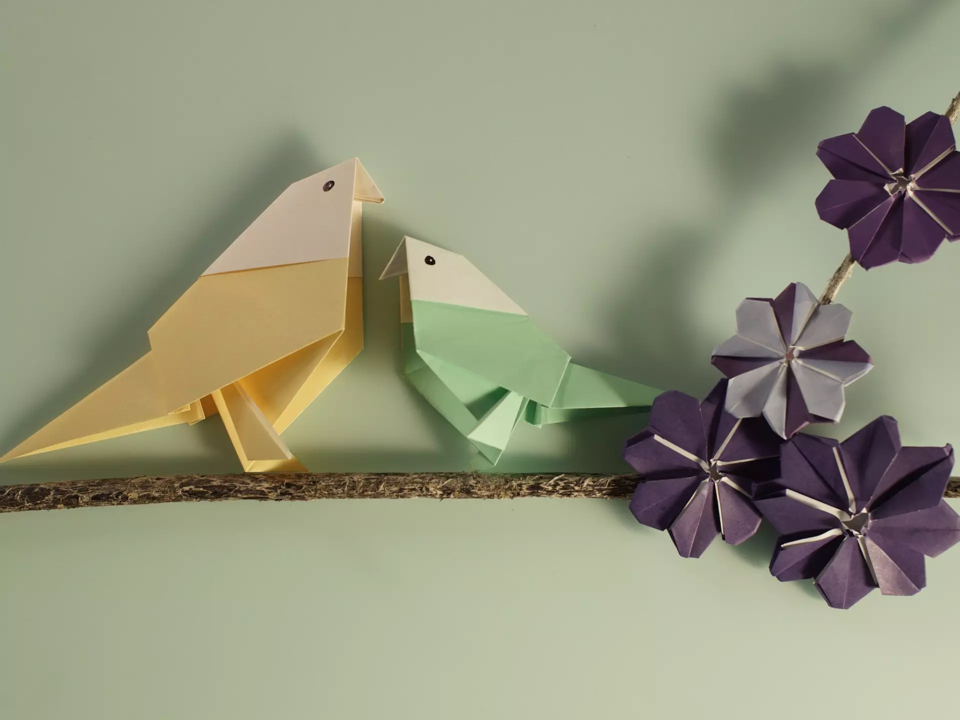 To paper origami birds perched on a tree branch with purple cosmos origami flowers on. Space for copy.
647269057
"origami, Origami, Paper, Paper craft, Art and crafts, Hand crafted, Handmade, Folded paper, Skill, Creative, Birds, Branch, Flowers, Purple, Cosmos flower, Together, Togetherness, Mother's Day, Love"