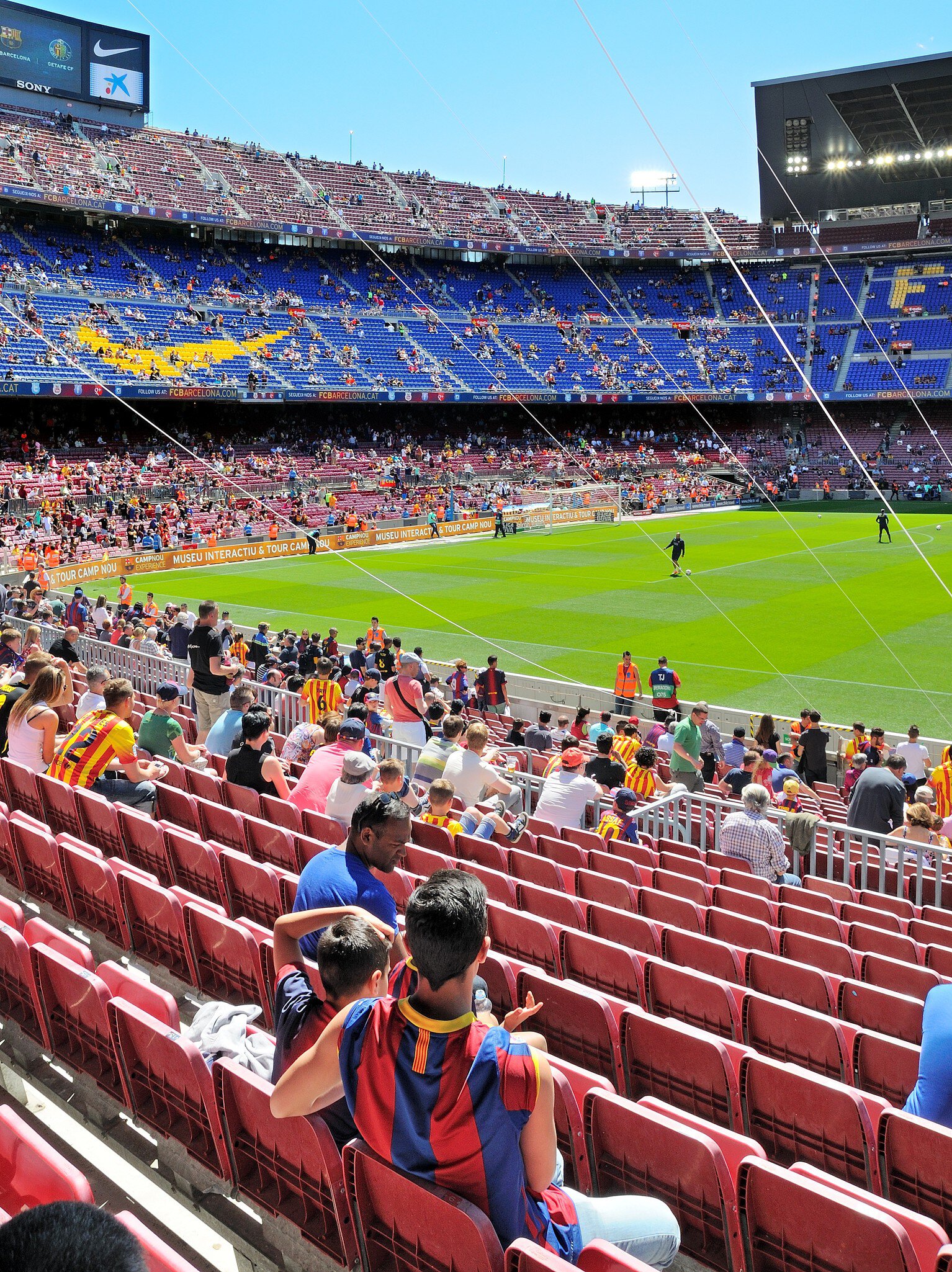 People watching a game at the Camp Nou Stadium in Barcelona, Spain.