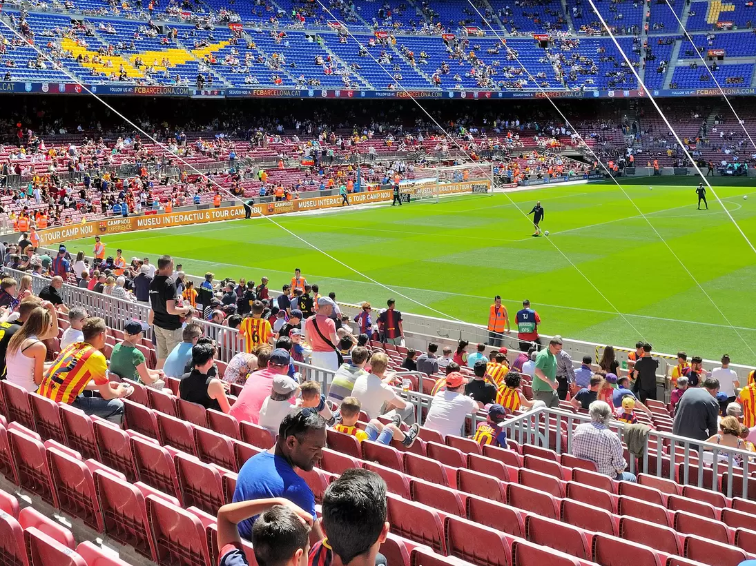 People watching a game at the Camp Nou Stadium in Barcelona, Spain.