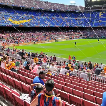 People watching a game at the Camp Nou Stadium in Barcelona, Spain.