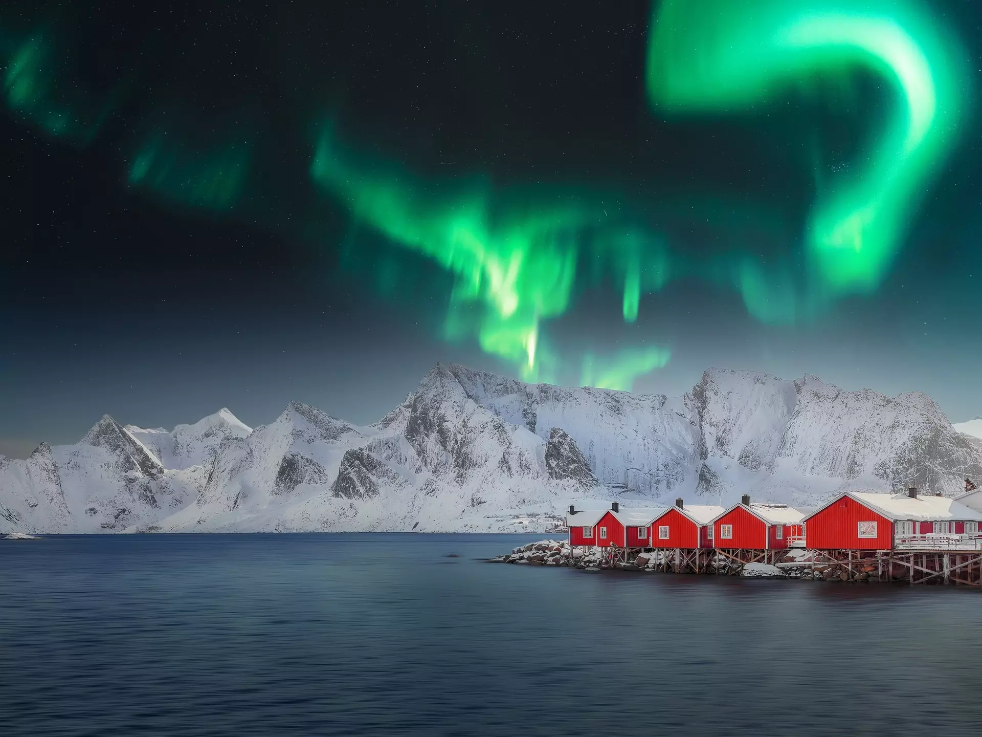 Winter view on Hamnoy village with Northern Lights. (Aurora Borealis).  Location: Hamnoy,  Moskenesoya , Lofoten; Norway, Europe