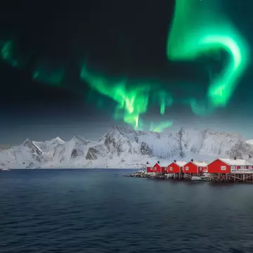 Winter view on Hamnoy village with Northern Lights. (Aurora Borealis).  Location: Hamnoy,  Moskenesoya , Lofoten; Norway, Europe