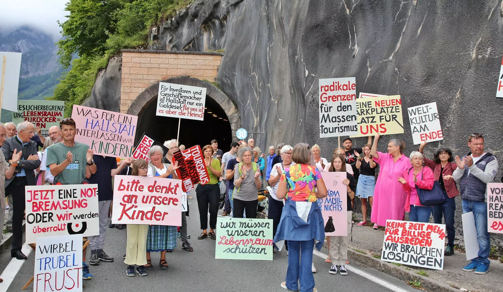 Last August, Hallstatt residents blocked a road to protest the ever-growing number of visitors © Reinhard Hoermandinger / AFP via Getty Images