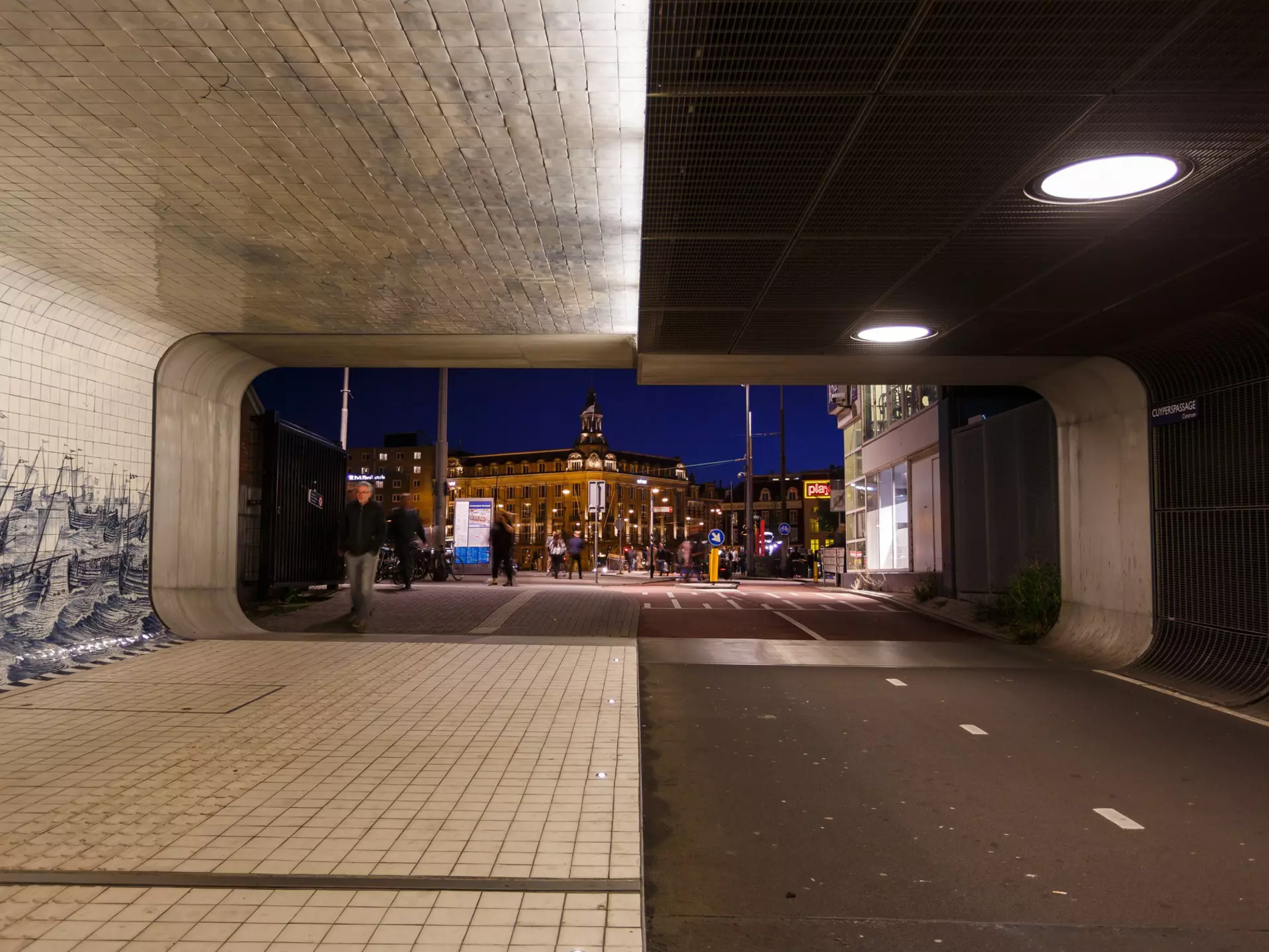 Amsterdam, Netherlands - September 22 2017: People are walking through the tunnel of Central Railroad Station in evening, License Type: media, Download Time: 2025-12-13T18:31:42.000Z, User: pinkjozie64, Editorial: true, purchase_order: 56530 - Guidebooks, job:  Global Publishing WIP (for books), client: Amsterdam 14, other: Jo-anne Riddell