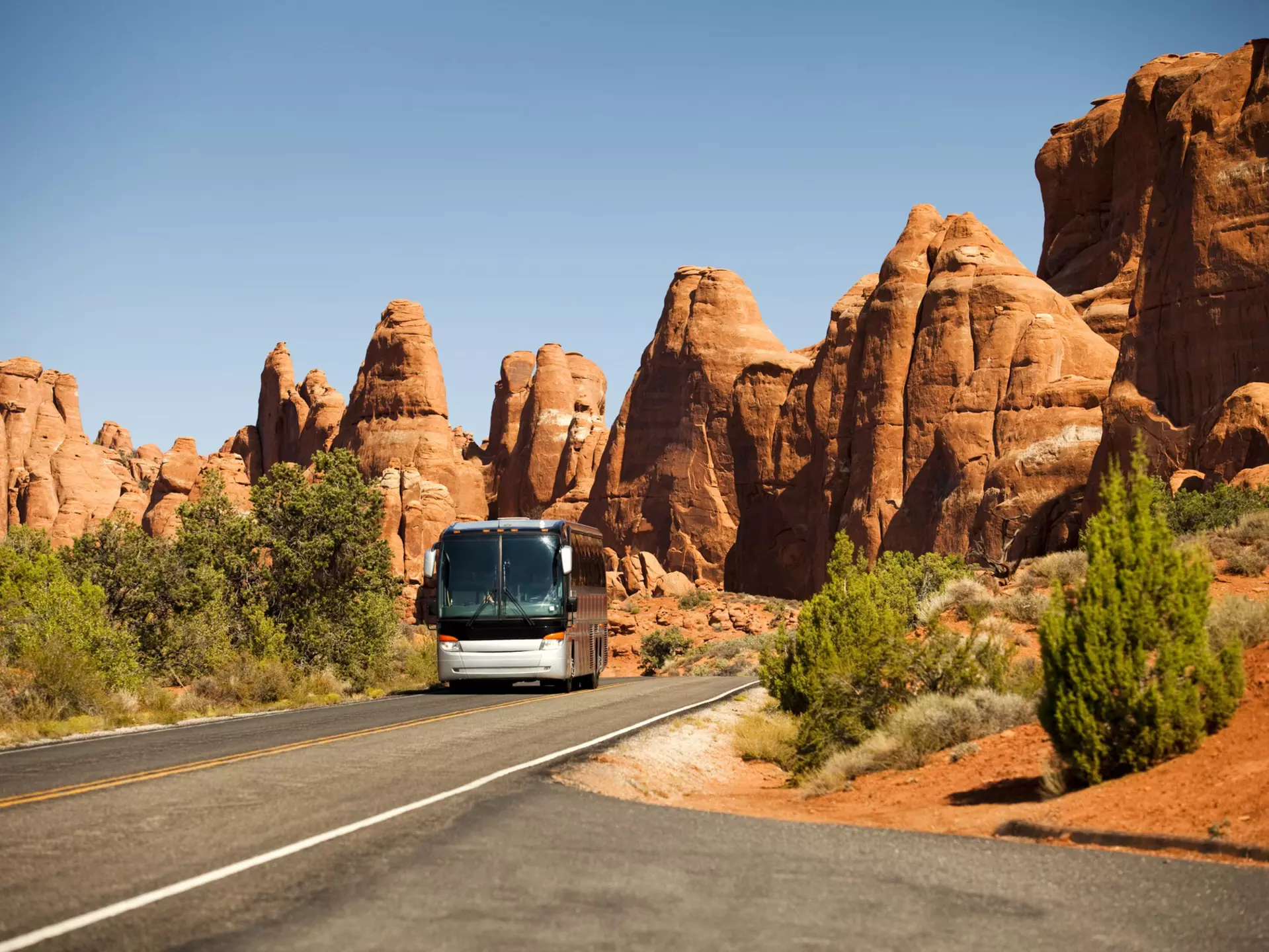 From driving desert highways to public transportation in the major cities, here's how to get around in Utah. Getty Images