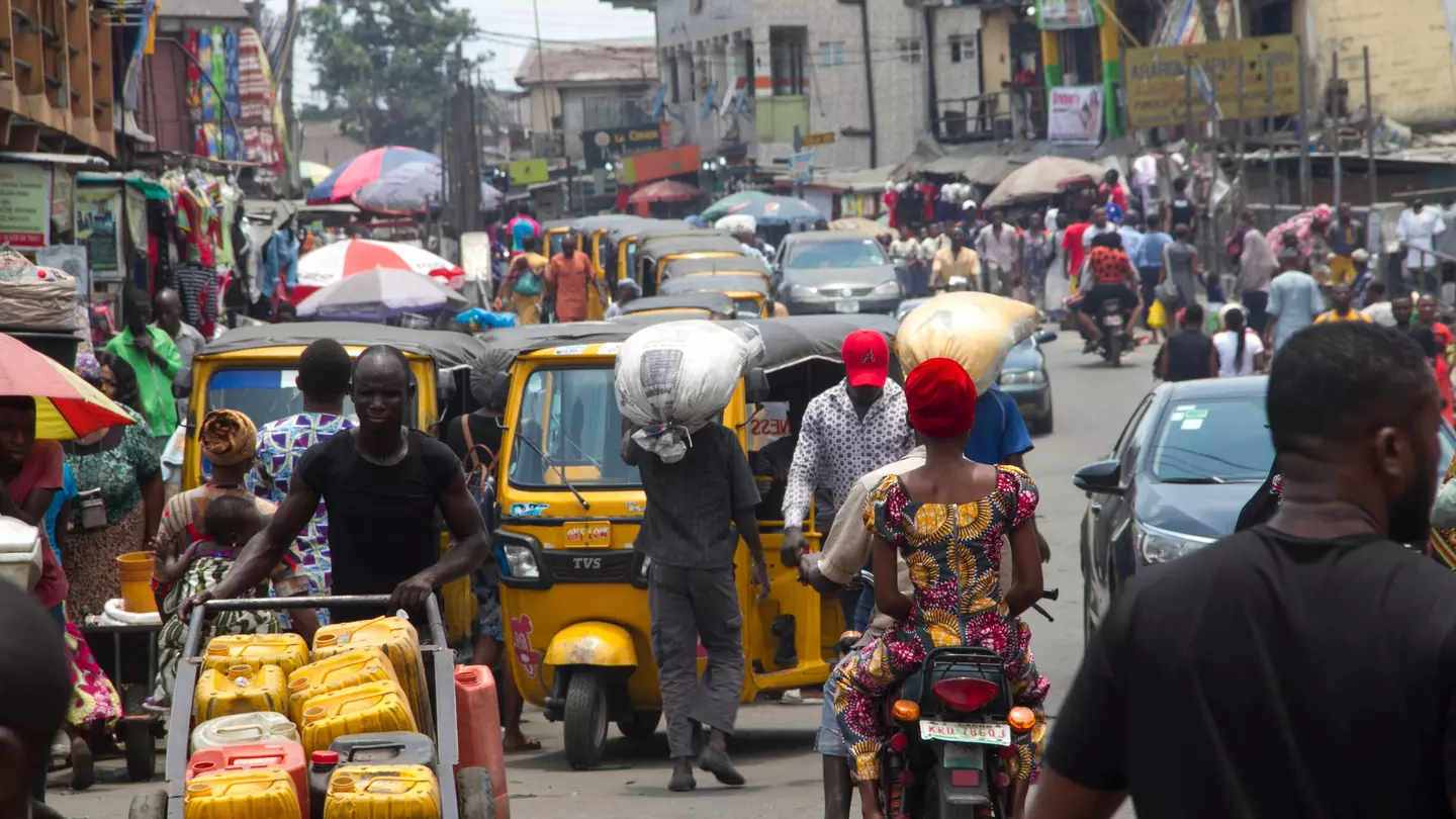 A busy street scene with lots of traffic in Ajegunle City, Lagos, Nigeria
