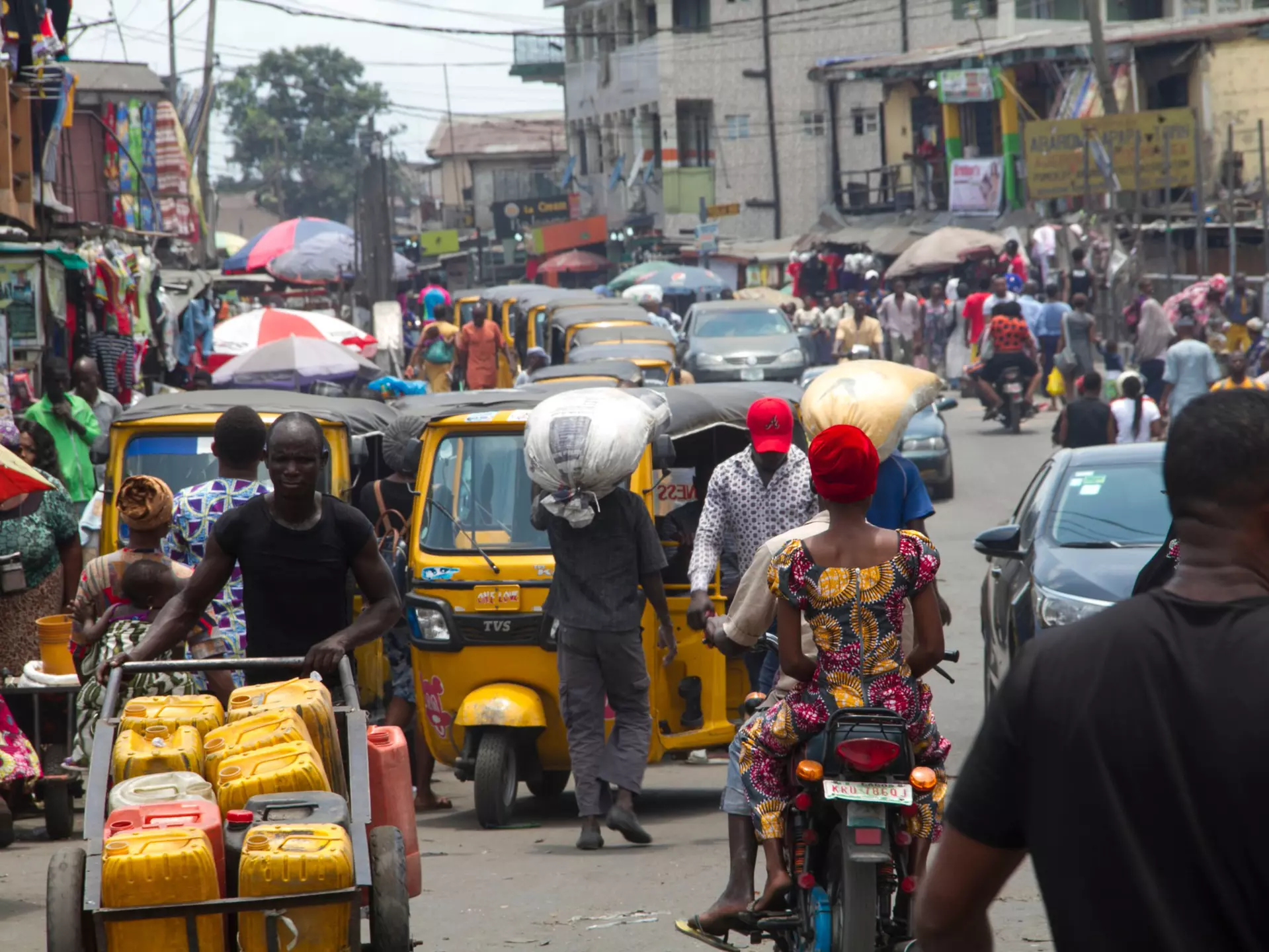 A busy street scene with lots of traffic in Ajegunle City, Lagos, Nigeria