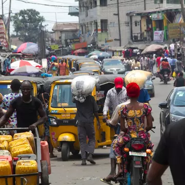 A busy street scene with lots of traffic in Ajegunle City, Lagos, Nigeria