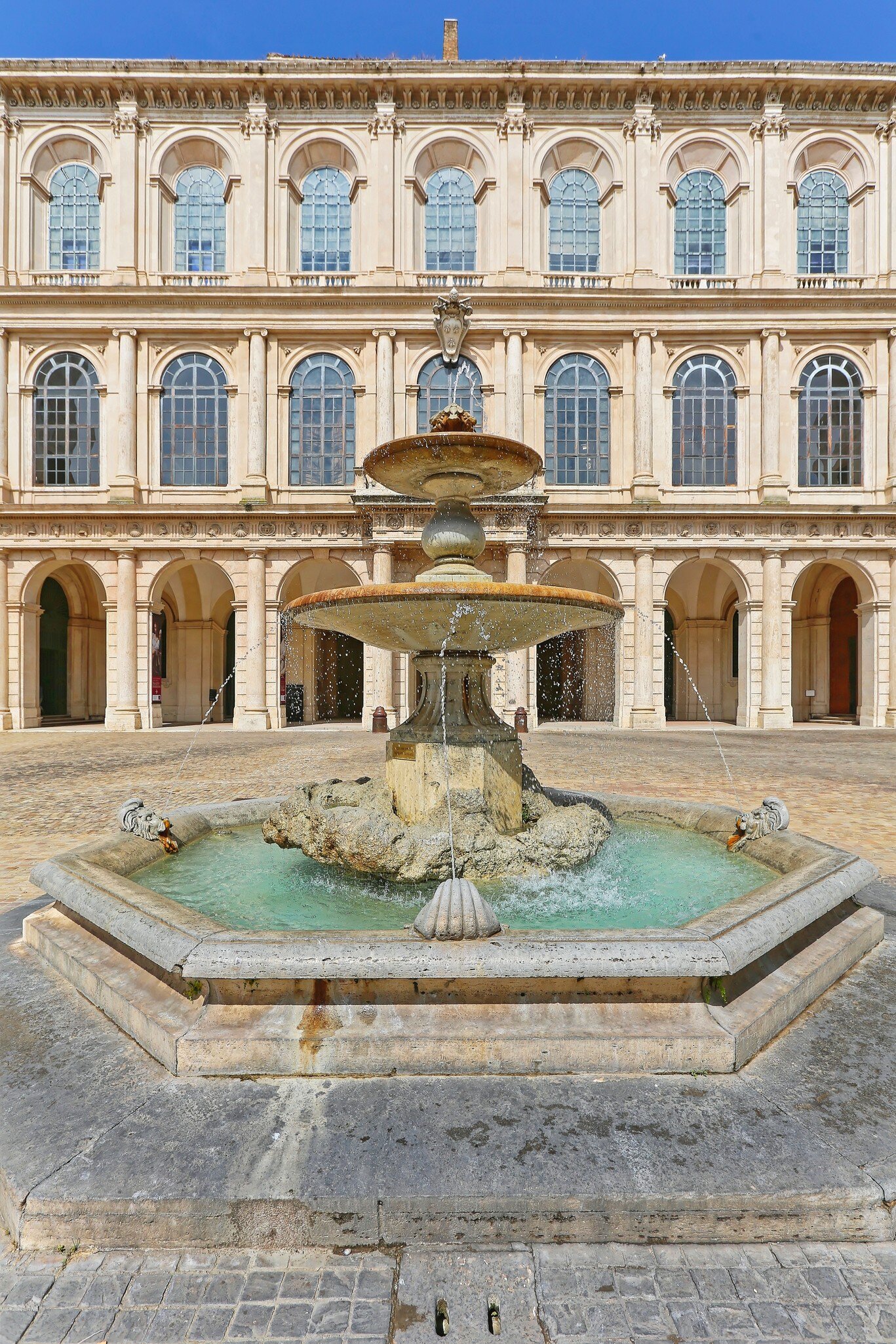 A fountain in front of the Palazzo Barberini in Rome, Italy.