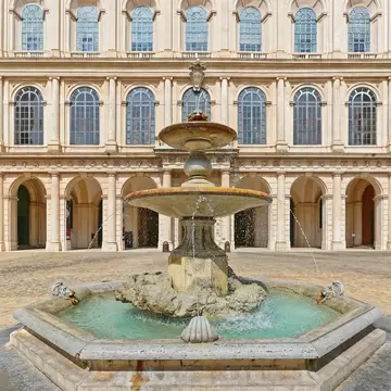 A fountain in front of the Palazzo Barberini in Rome, Italy.