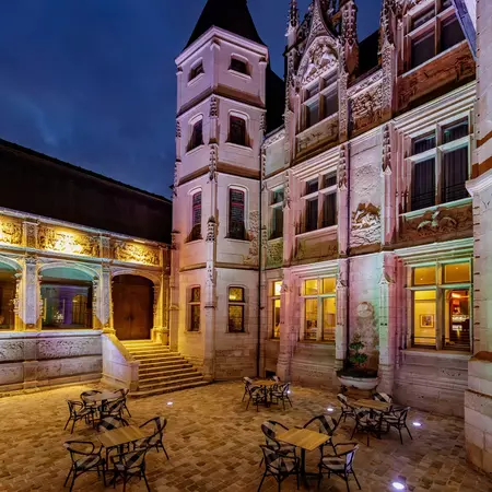 A Renaissance-era building lit up at night