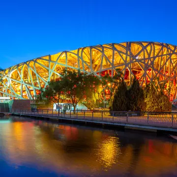 May 6, 2019: Exterior of Beijing National Stadium (also known as the Bird's Nest) lit up at night.
1153365475
Bird's Nest, Asia, China, Famous Place, Asian, Stadium, Travel Destinations, Horizontal, Tourist, Light - Natural Phenomenon, Photography, Night, International, Neon Lighting, World, Summer, Beijing, Park, Sport, Built Structure, Outdoors, Building, Water, Dusk, Capital Cities, The Olympic Games, Scene, Light, National, Cityscape, Architecture, Bridge - Built Structure, Modern, Lighting Equipment, Travel, Twilight, Bird, Tour, Landscape, Beauty, Famous, Tourism, Bridge, Sunset, City, View, Attraction, Animal Nest, Olympic, China - East Asia, Pond, Architectural Dome, Chinese, Reflection, Game