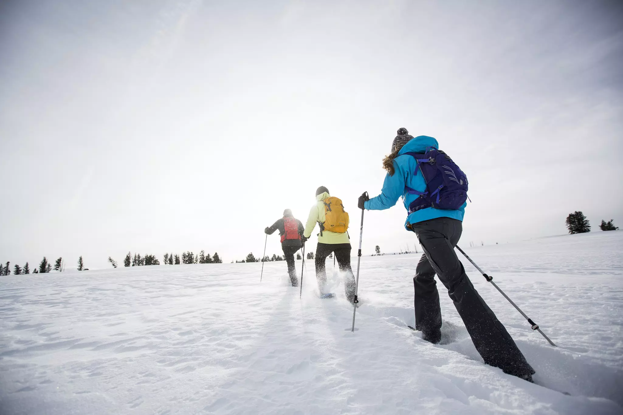 Three people snow shoeing near Bozeman