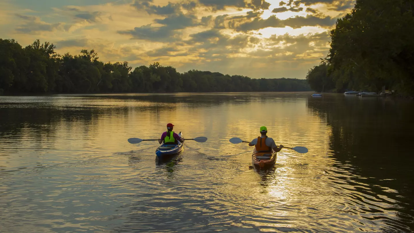 Couple kayaking in the James River at sunset in Richmond, Virginia