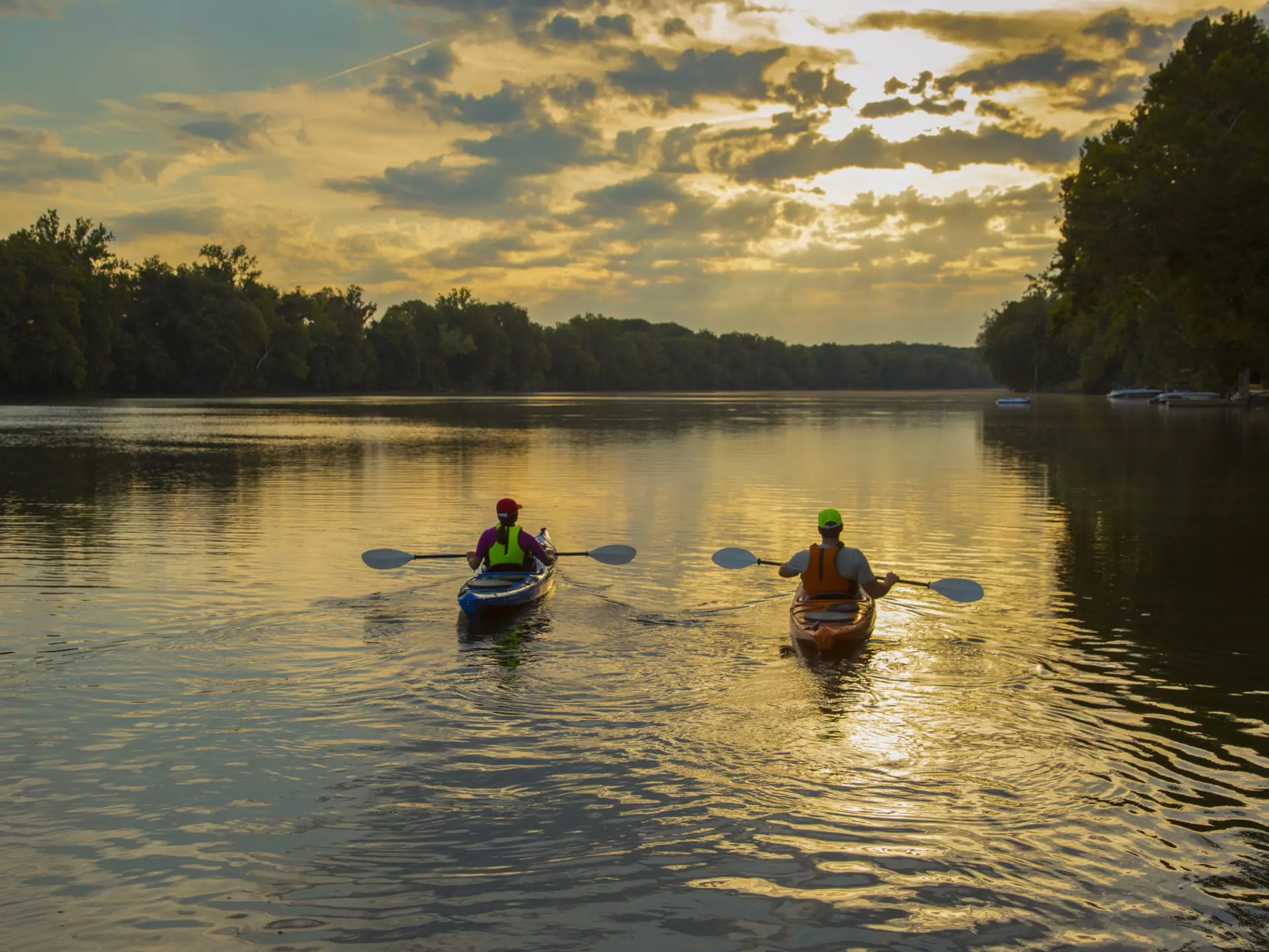 Couple kayaking in the James River at sunset in Richmond, Virginia