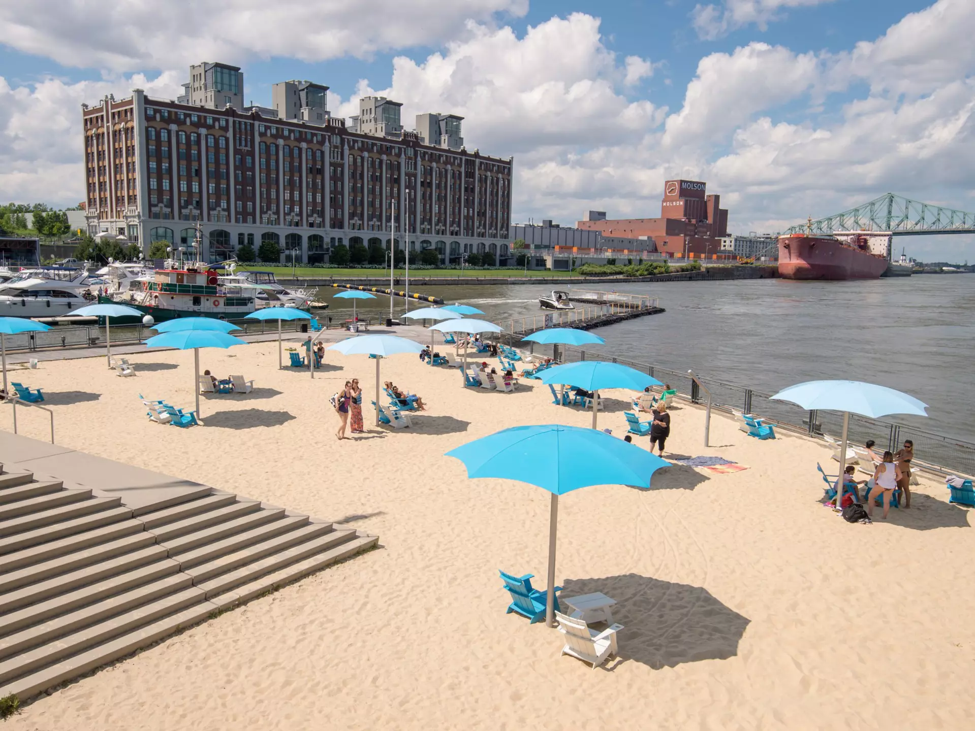 July 12, 2017: Clock Tower Beach in the Old Port of Montreal.
1144863668
architecture, beach, boats, building, canada, canadian, city, fleuve saint laurent, harbor, harbour, jacques cartier bridge, landmark, landscape, montreal, montreal beach, montreal cityscape, montreal summer, old port, people, plage, quebec province, river, sand, st lawrence river, tourism, travel, urban, vieux port, water