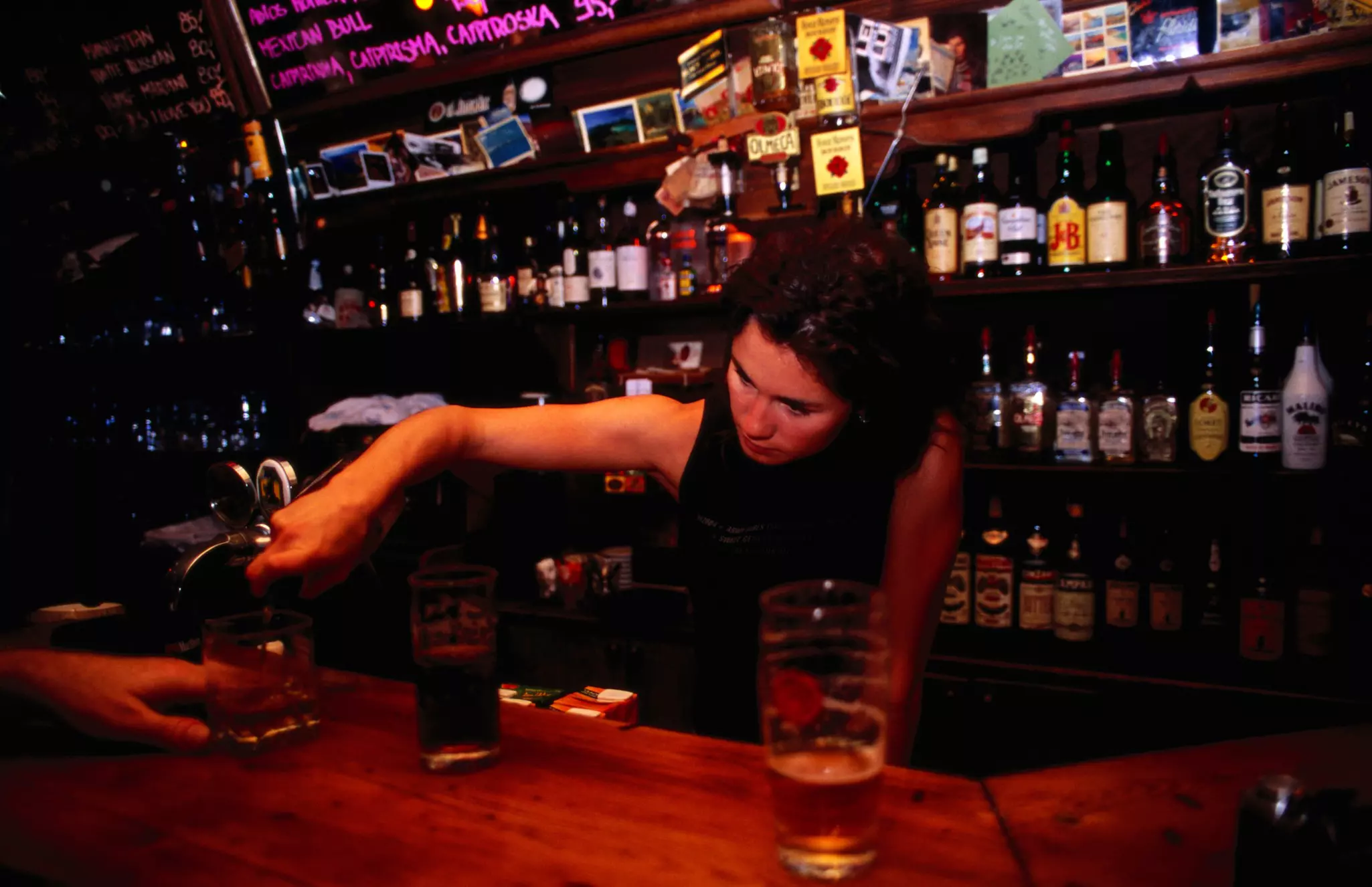 Bartender pouring shot of whiskey