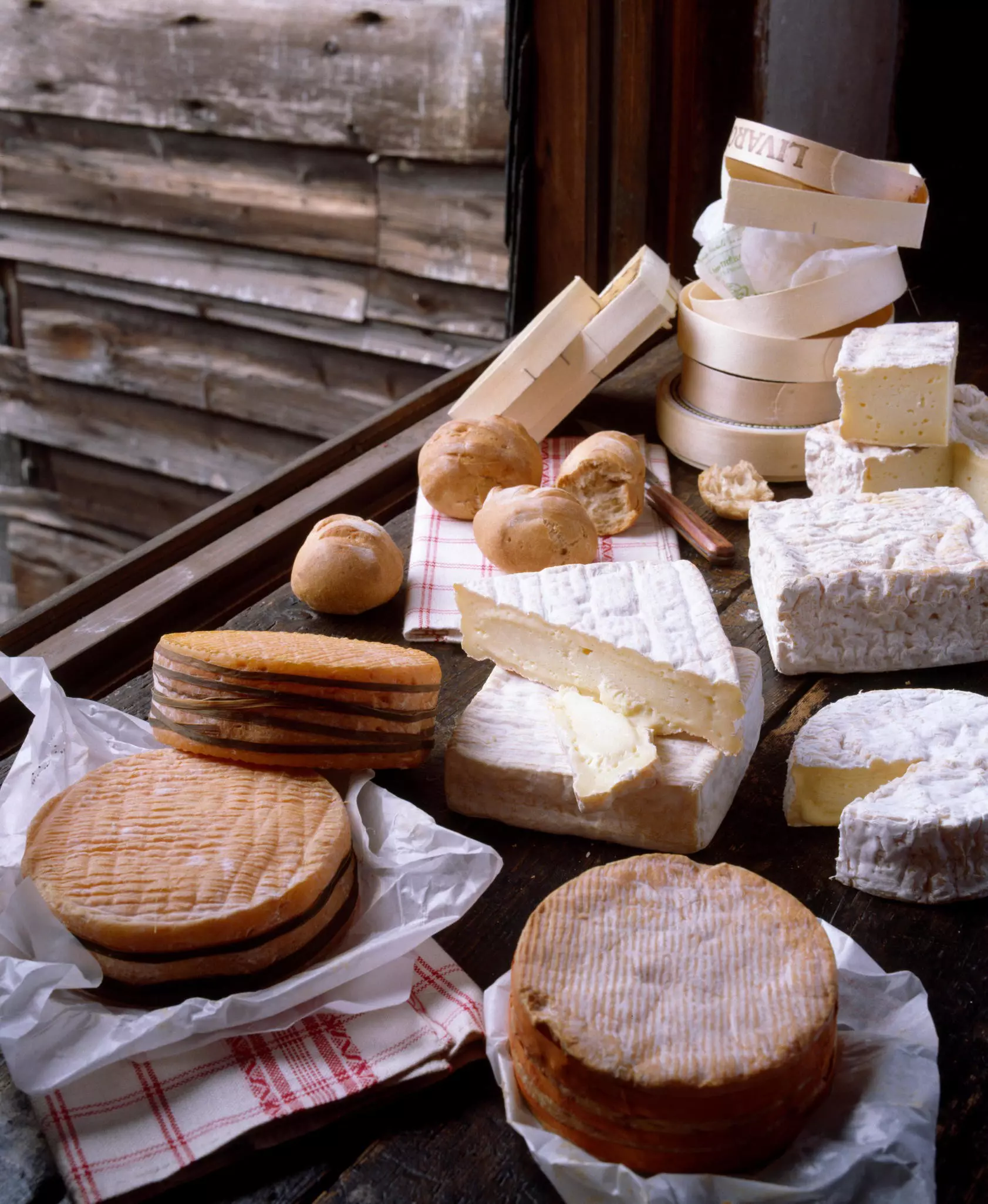Selection of French cheeses: Livarot, Pont-l'évêque and Pavé d'auge.