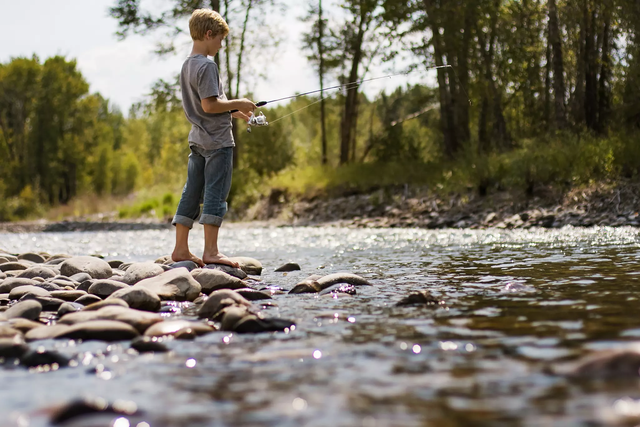 A boy fishing in Bozeman