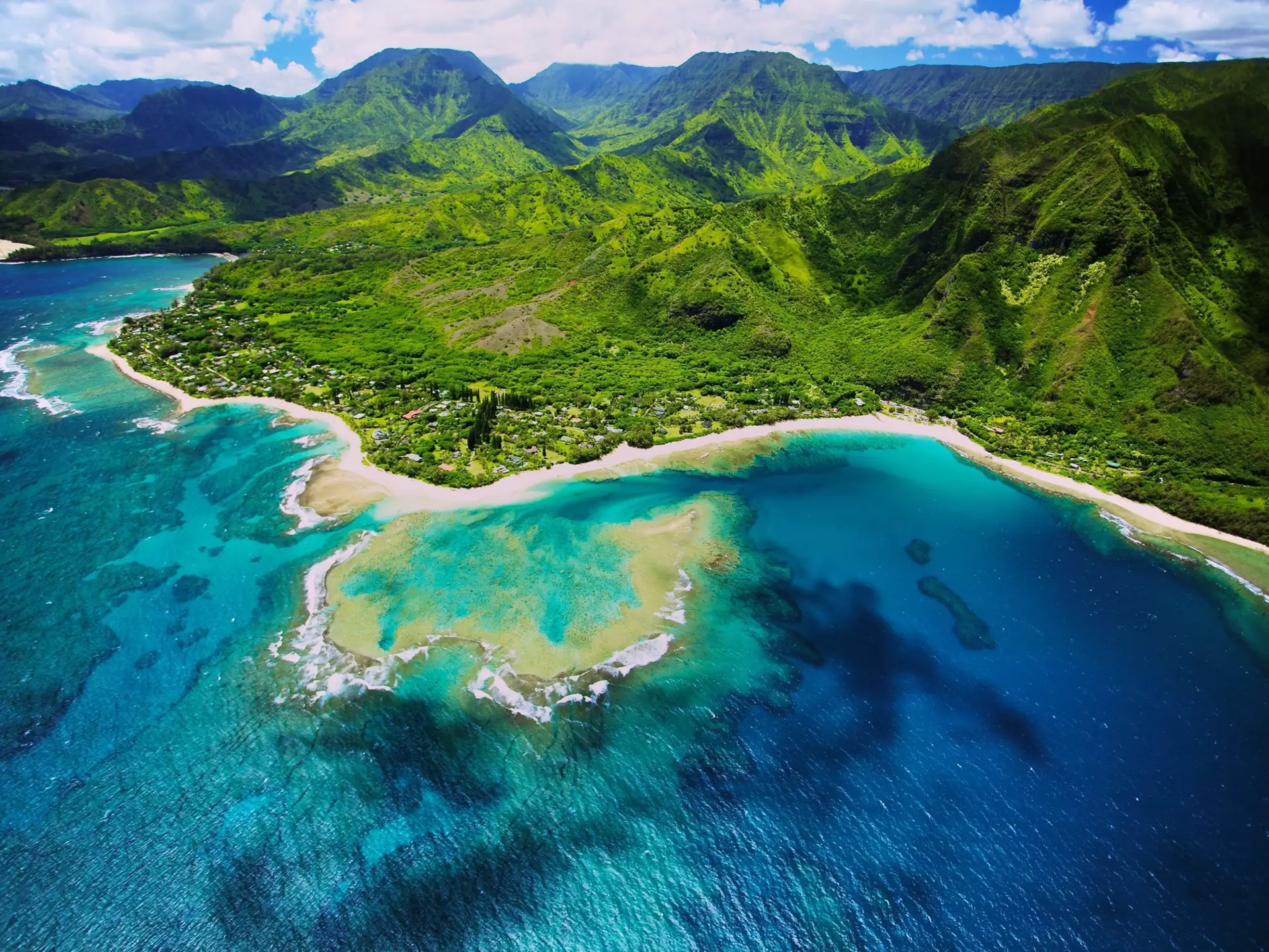 An aerial photo of Tunnels beach. Tunnels is located on Kauai's North Shore and is named after the tunnels that snorkelers and divers can observe when navigating the reef.
181172047
Aerial View; Beach; Kauai; Outdoors; Snorkeling; Horizontal; No People; Tunnels Beach; Pacific Islands; Photography; Hanalei Bay; Hawaii Islands; Reef;