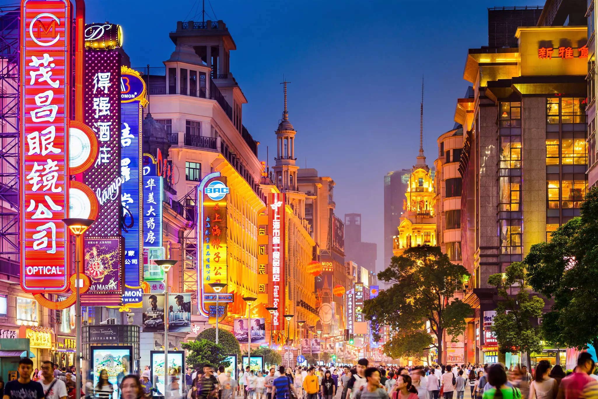 Neon signs light up East Nanjing Road in Shanghai, China.