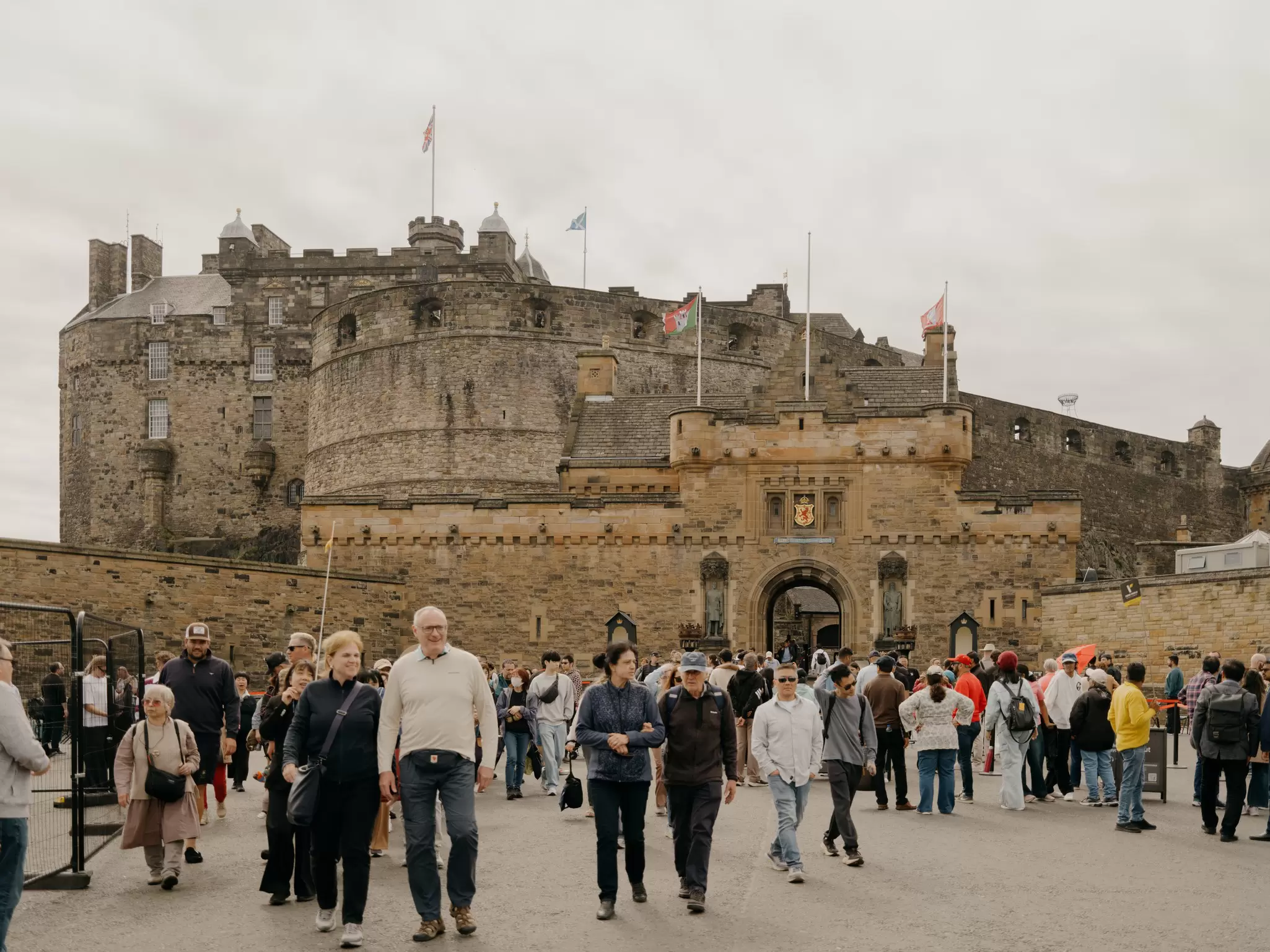People wandering the Edinburgh Castle Esplanade, Scotland.
