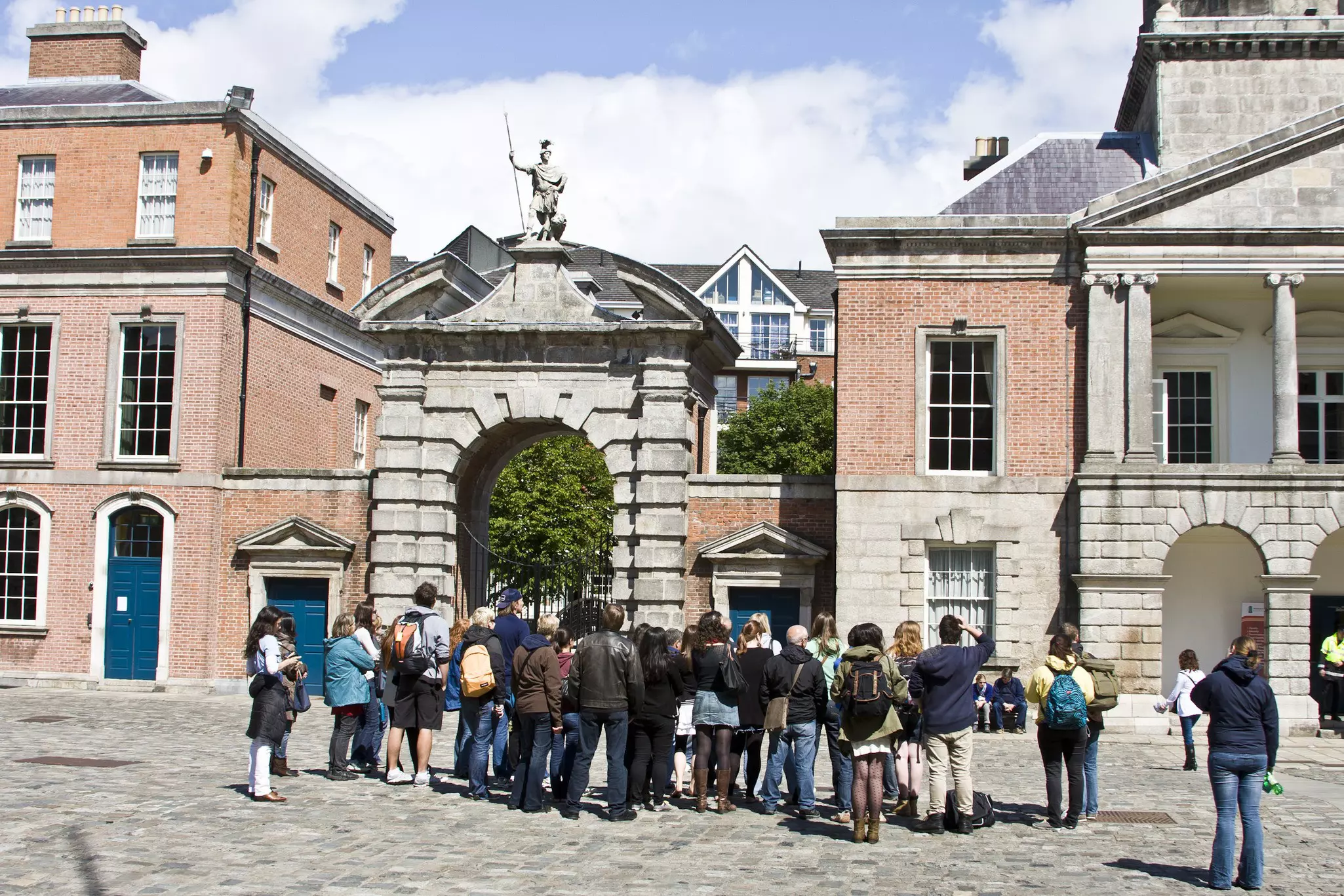 A walking tour group gathered in Dublin Castle. 