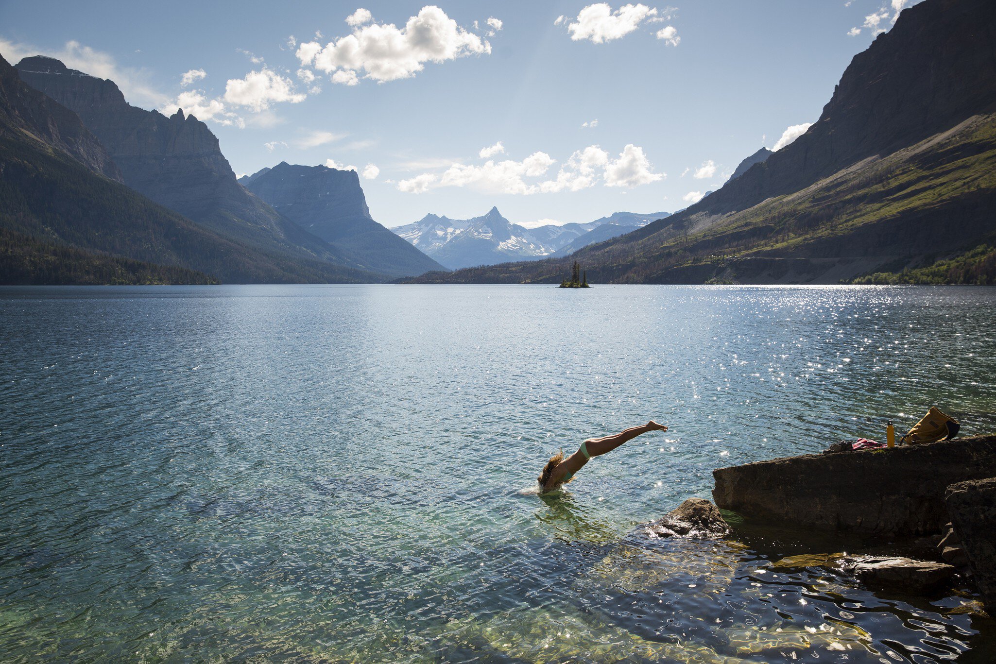 Clear mountain waters and peaks on a summer day in Glacier National Park, Montana