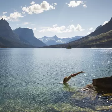 Clear mountain waters and peaks on a summer day in Glacier National Park, Montana