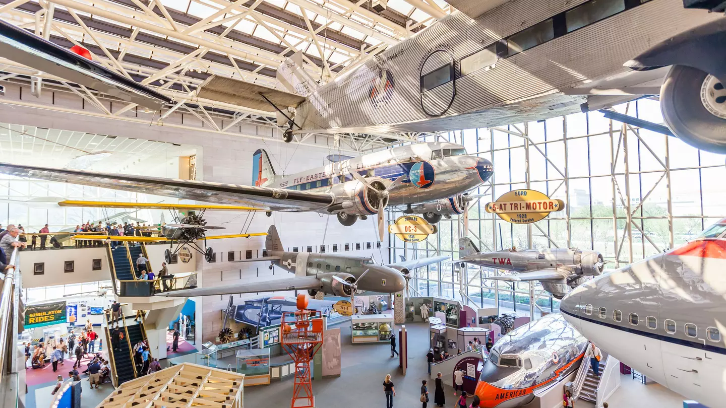 A large gallery of planes and other flying machines within a museum